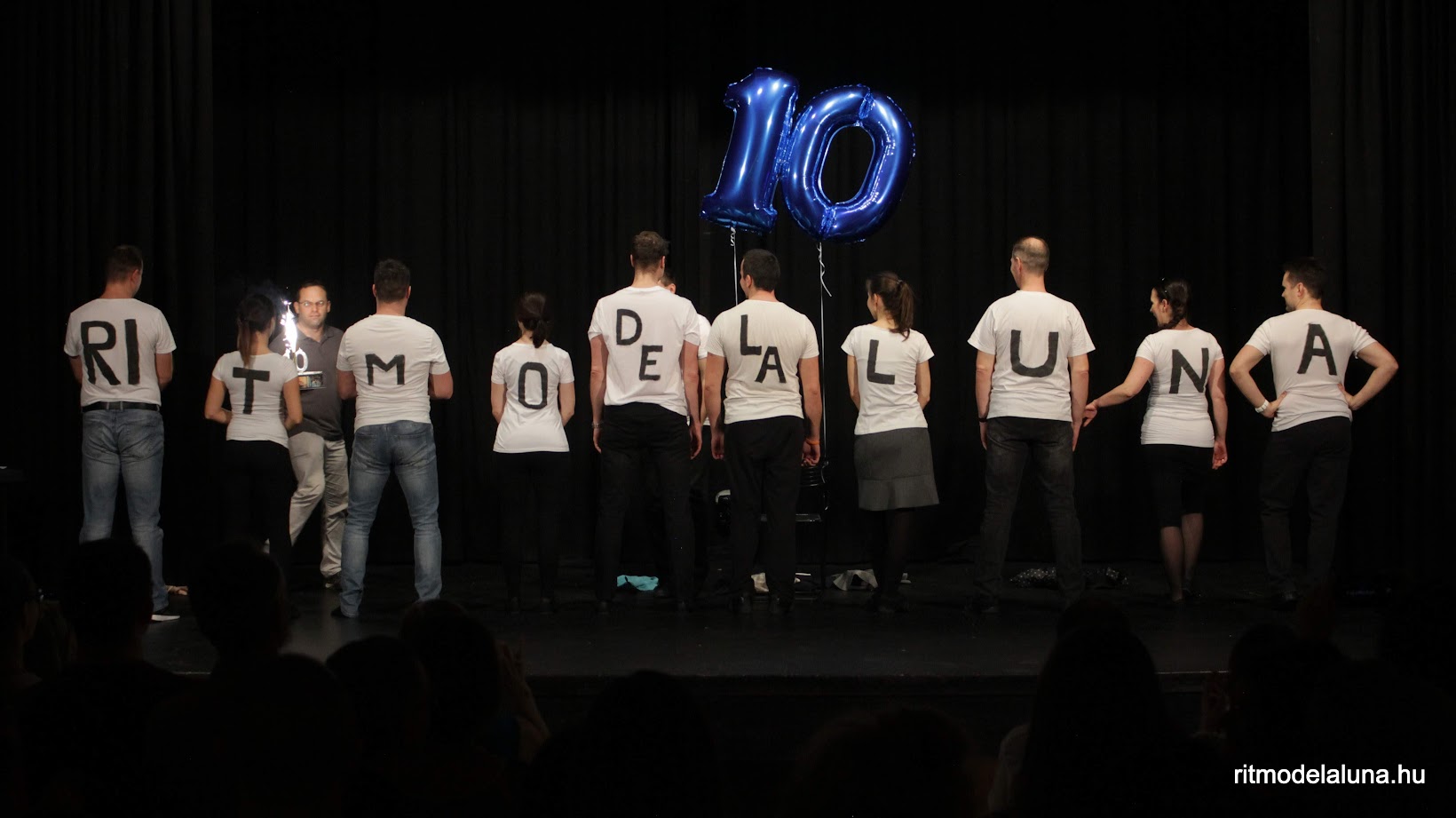 Full moon obscured by dark pine needles at night