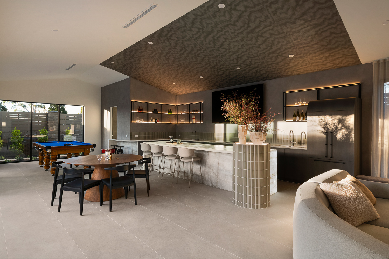 Kitchen and stone island at EvoBuilt’s Serpells Road renovation.