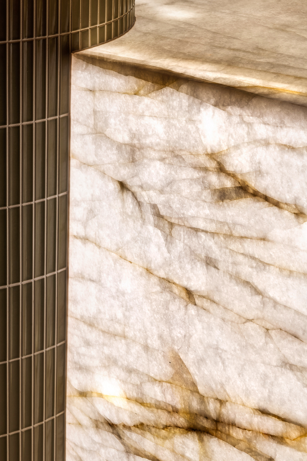 Backlit stone and metal detailing at Serpells Road.