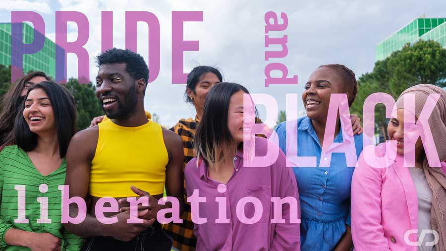 A diverse group of six adults stand together outdoors, smiling and interacting with one another. The group includes people of different racial, ethnic, and cultural backgrounds. Large pink text over the image reads "PRIDE and BLACK liberation." Modern office buildings and trees appear in the background. The image conveys community, belonging, and solidarity between LGBTQ+ Pride and Black liberation movements.