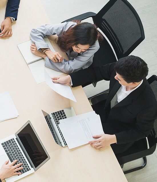 Professionals reviewing financial documents