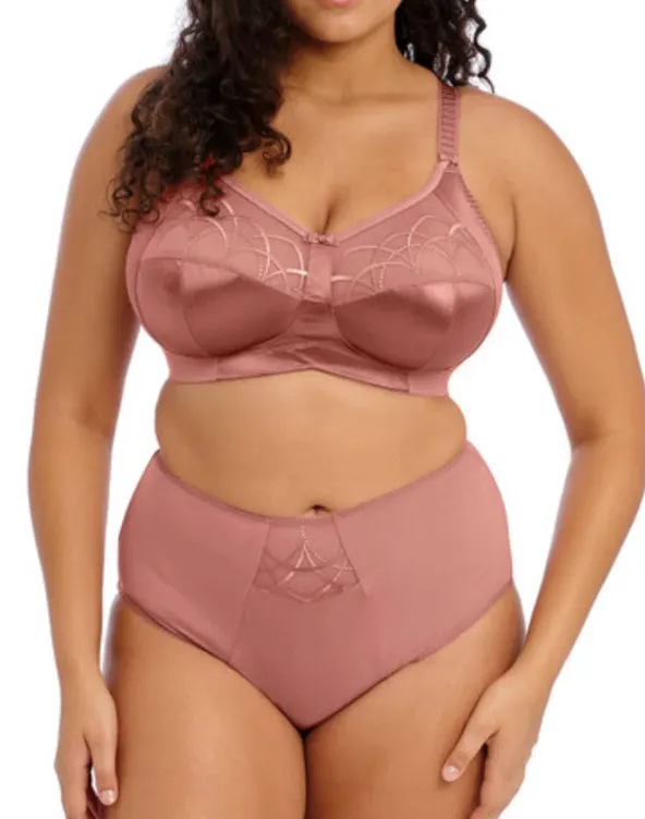 woman in lacy bra grasping measuring tape