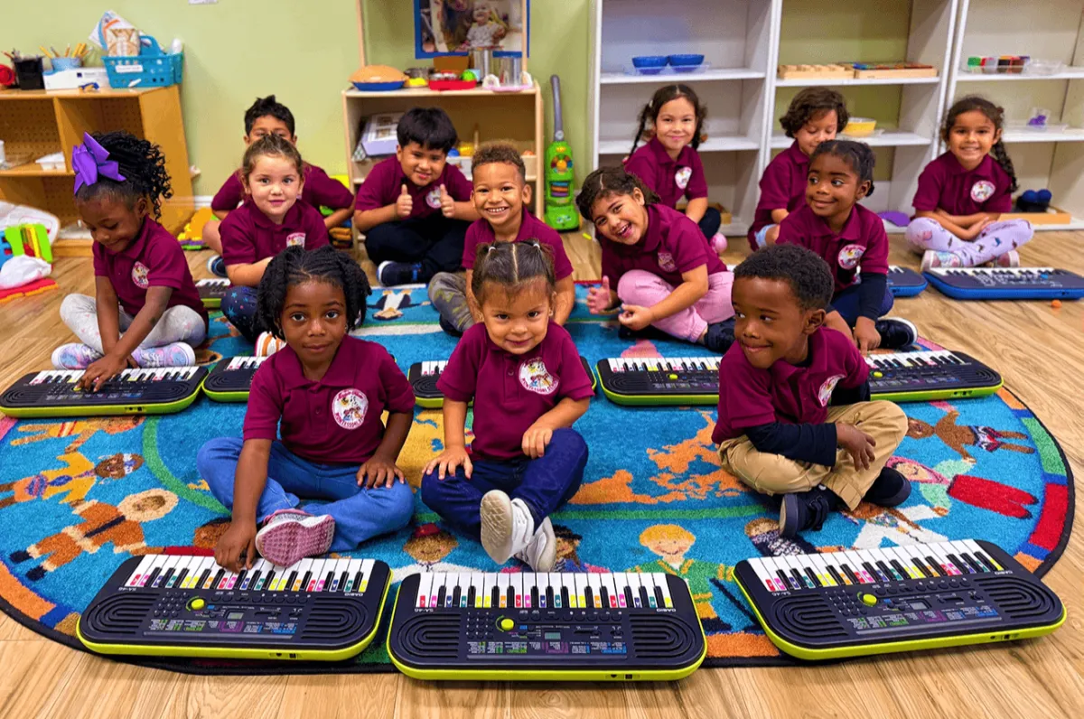 Children in msic class with small keyoards