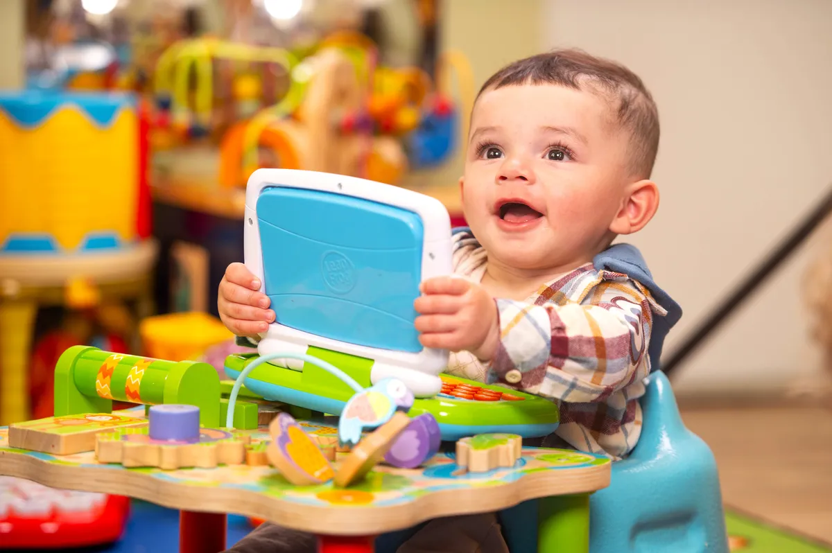 Infant playing with toys