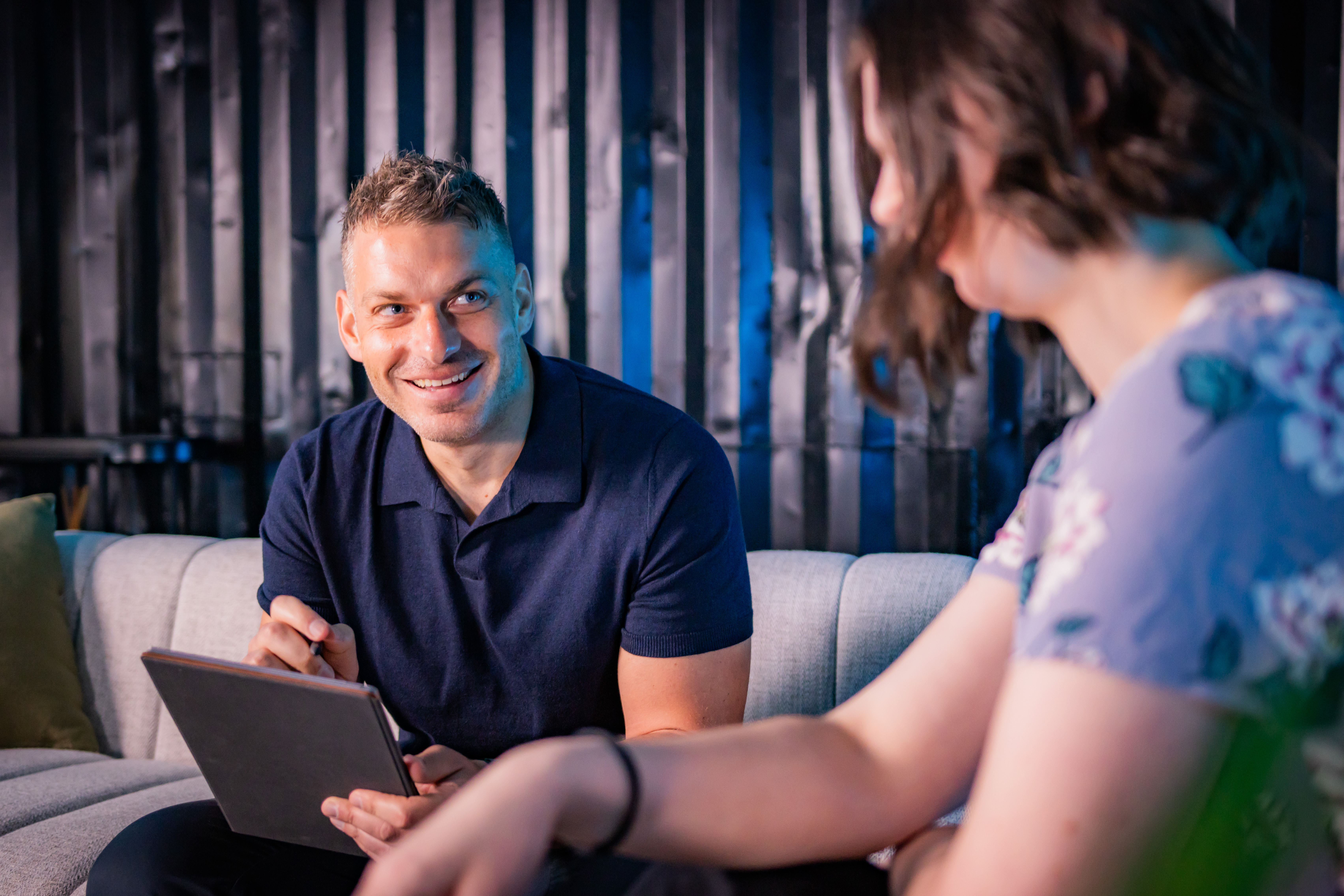 adam talking in a workshop with a client to identify improvement opportunities in their business t