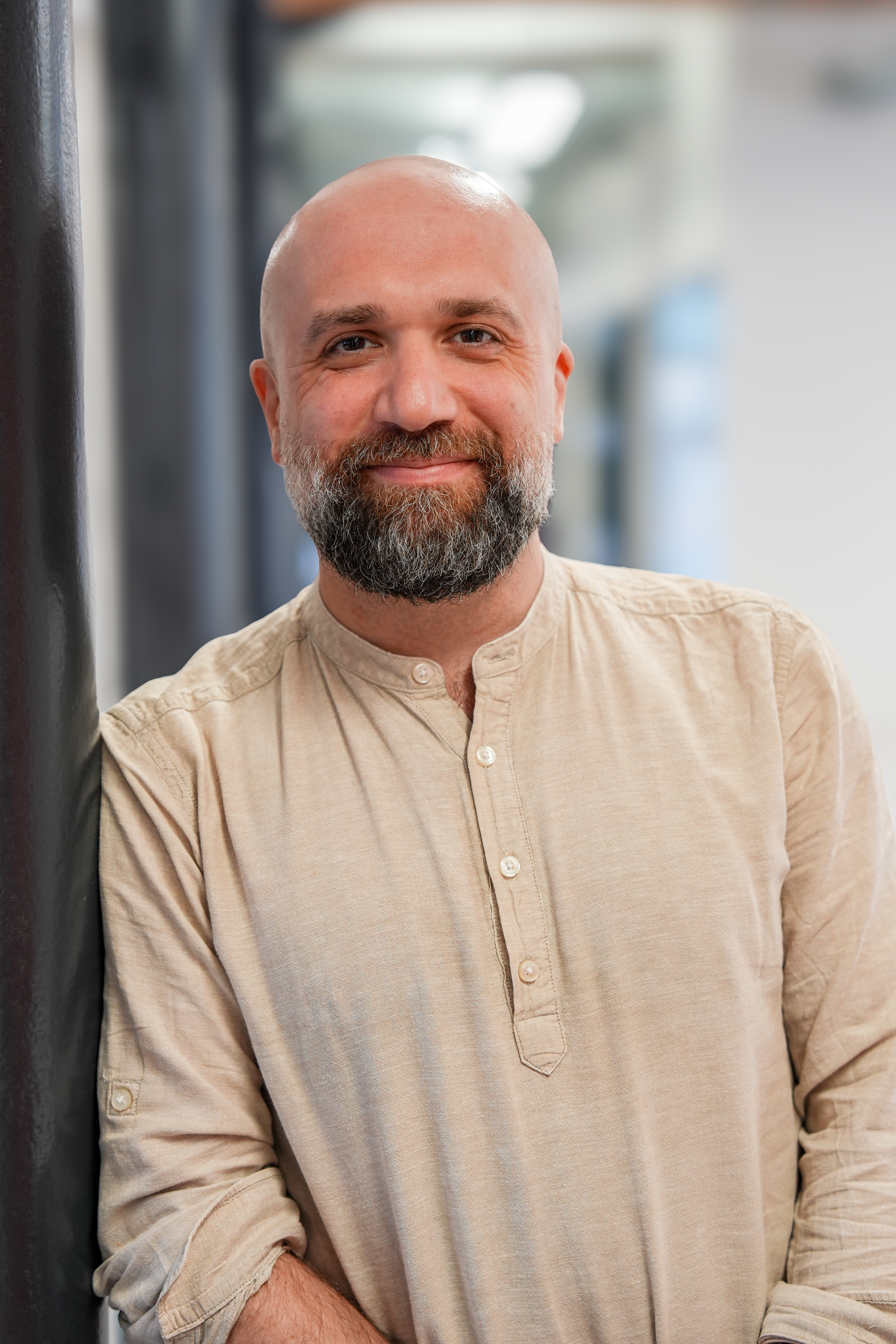 	Alastair Ballentyne, Belief Coding facilitator and EFT practitioner, smiling in a beige linen shirt