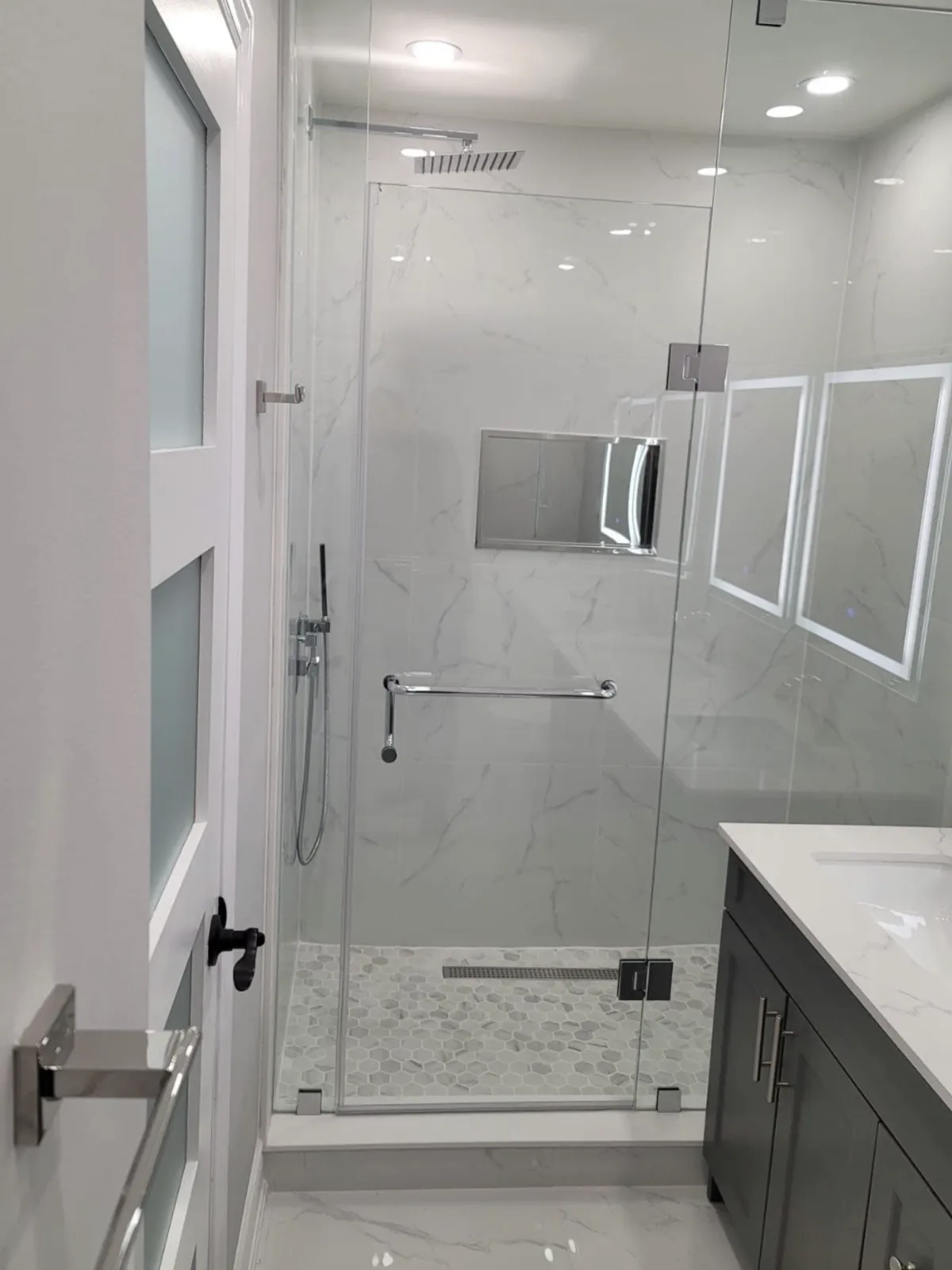  “Walk-in shower with low barrier entry and modern tile.”