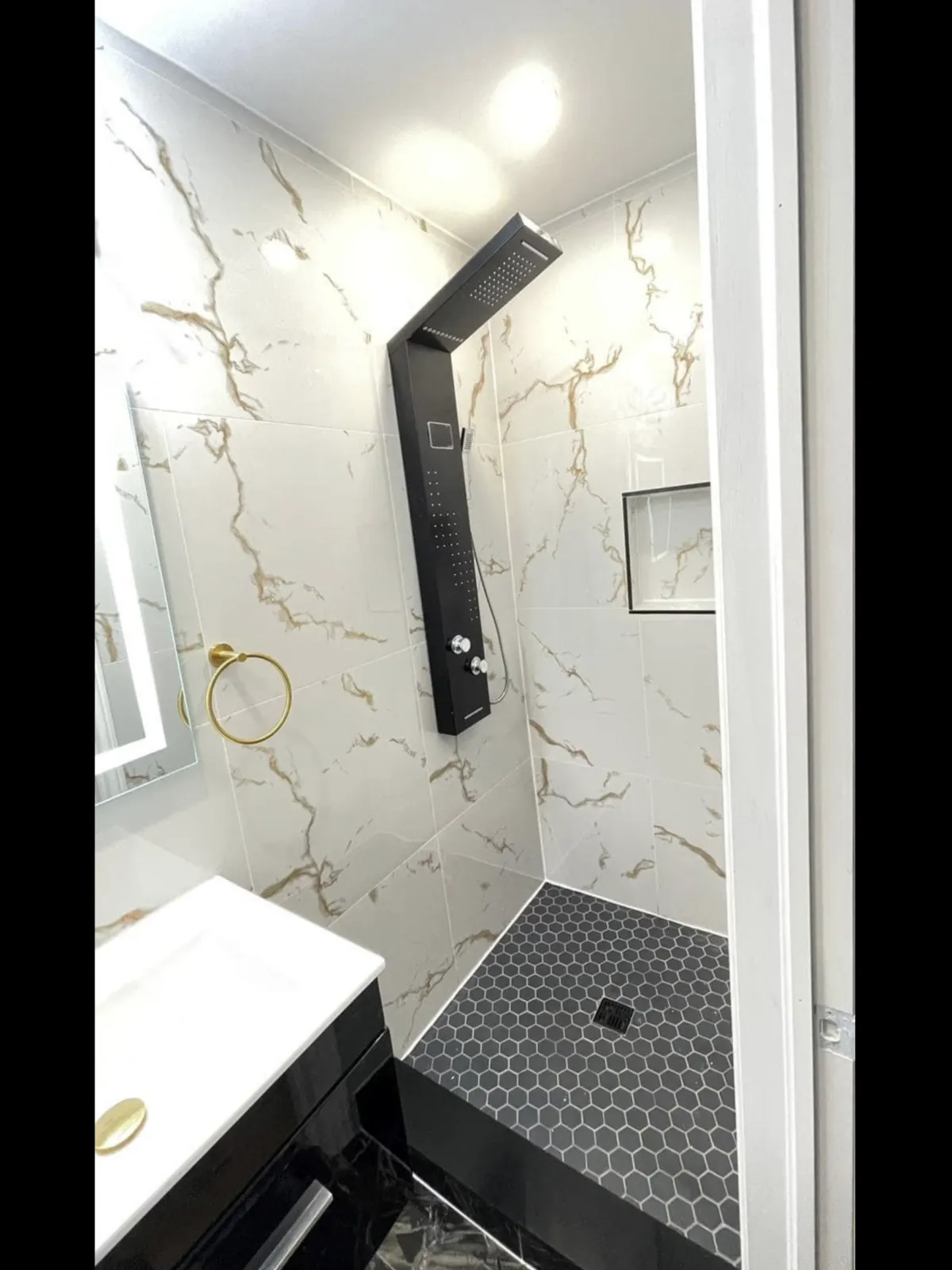 “Walk-in shower with low barrier entry and modern tile.