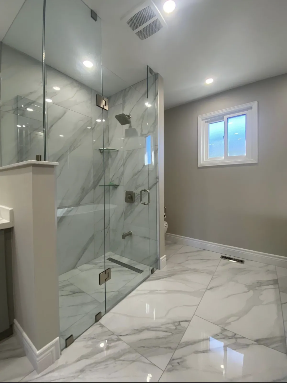 “Walk-in shower with low barrier entry and modern tile.