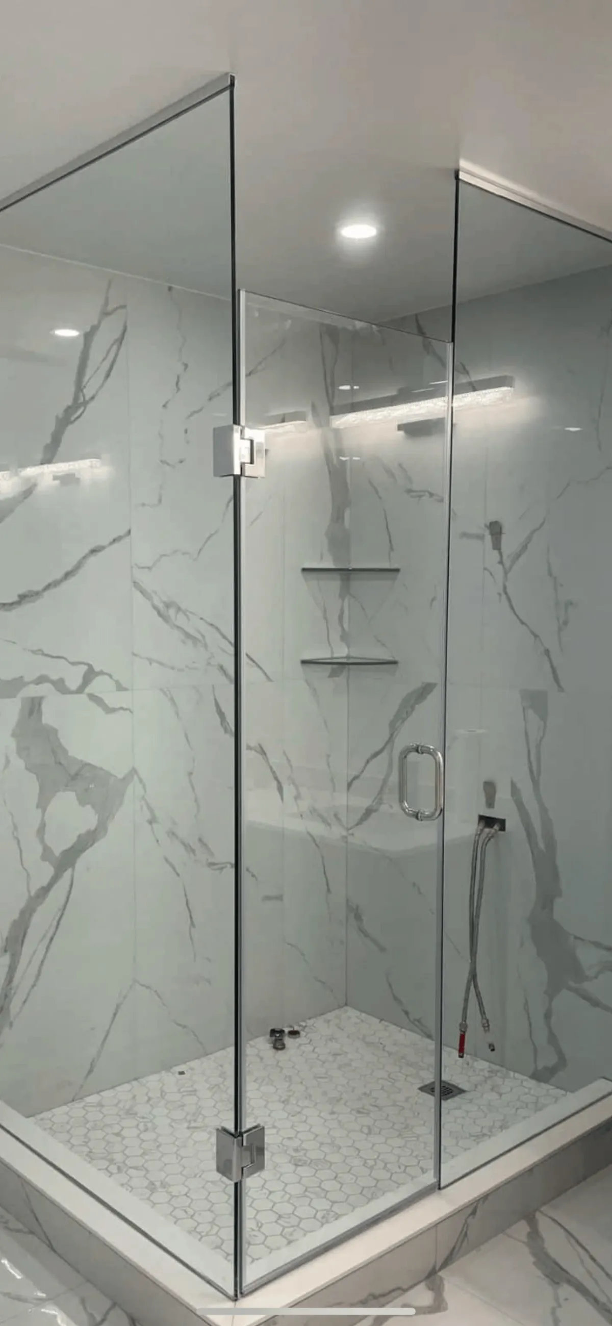 “Walk-in shower with low barrier entry and modern tile.