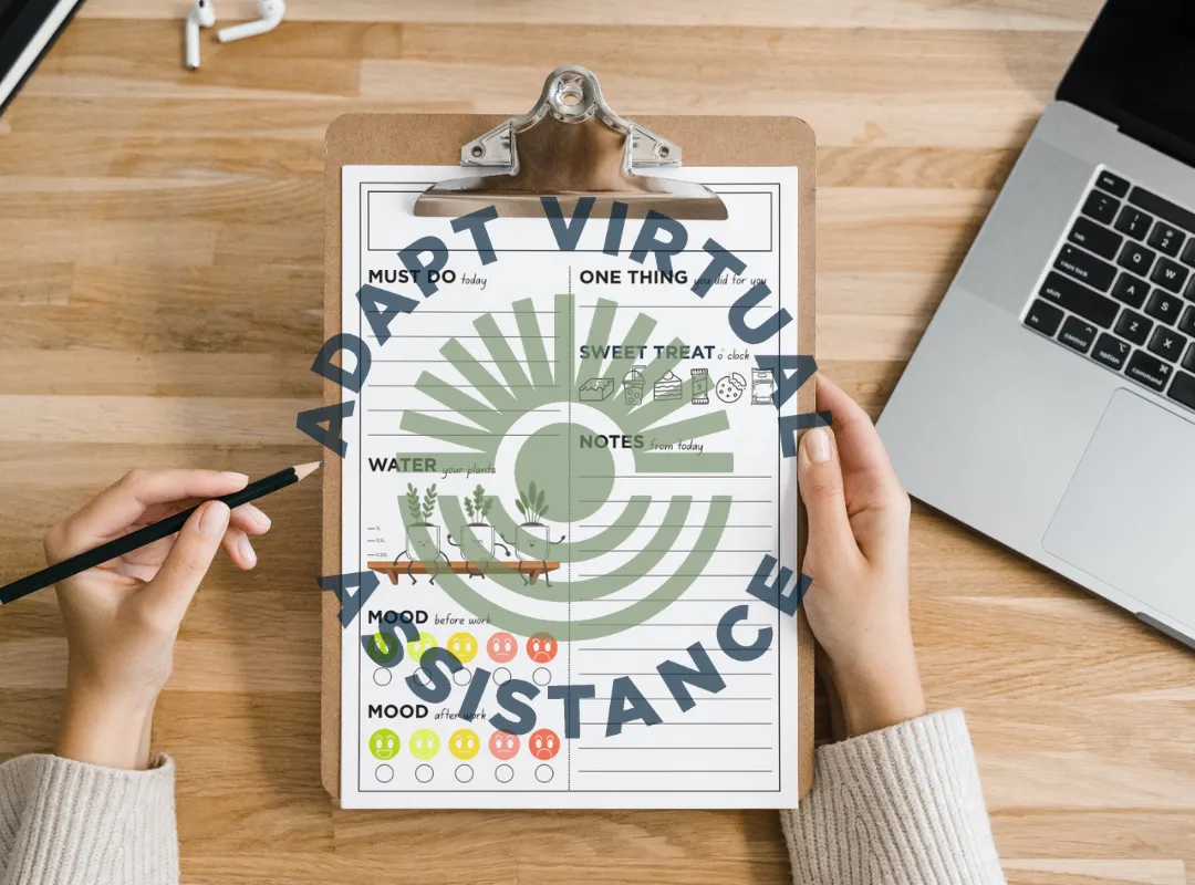 overhead shot of arms holding a clipboard with a copy of the tracker resource and the adaptva logo placed overtop. 