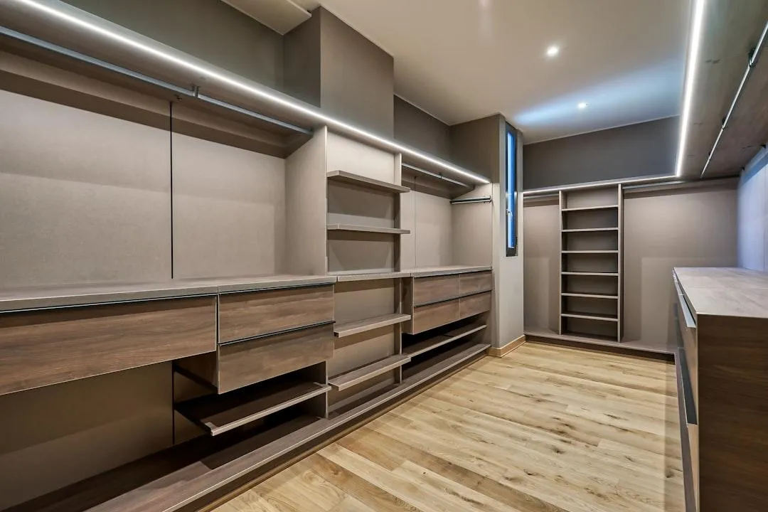 Kitchen remodeling project with modern cabinets, counters, and lighting