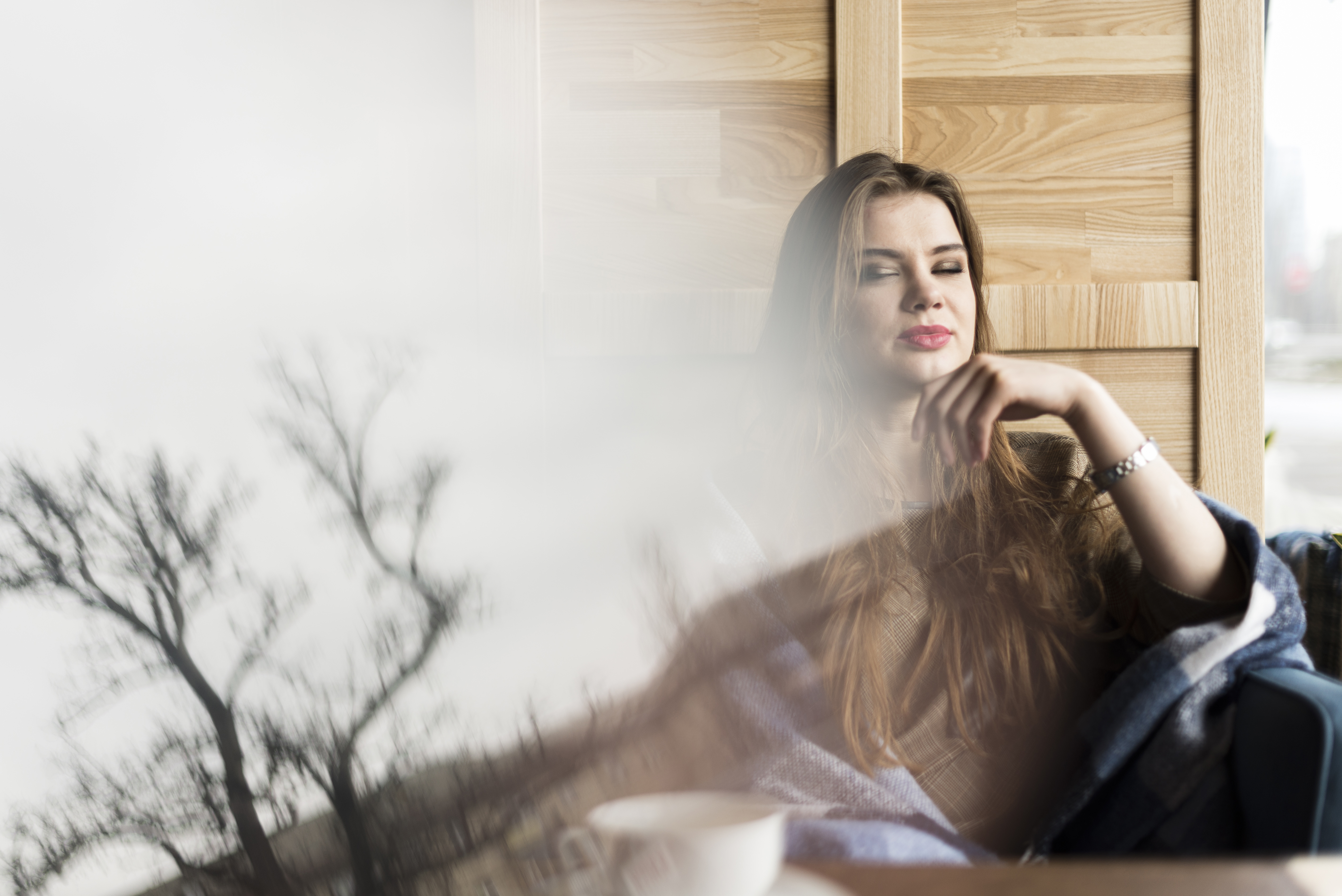 Woman sitting calmly and confidently while learning to set healthy boundaries without guilt.