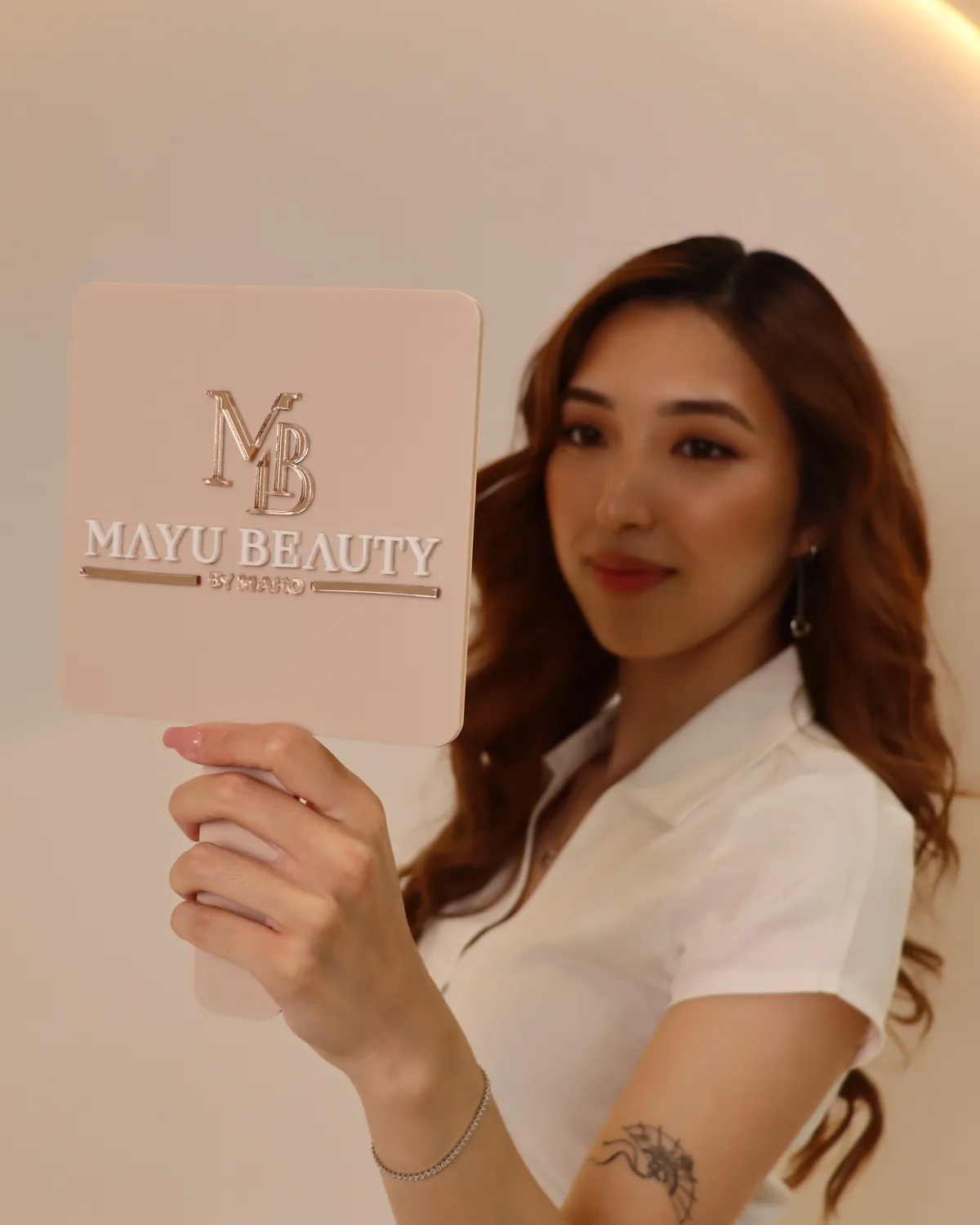 Client receiving an eyebrow shaping treatment