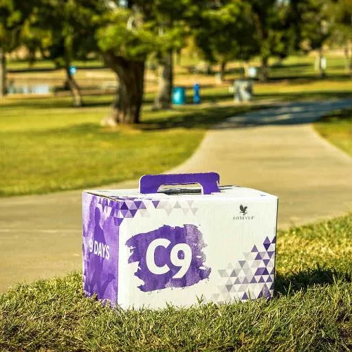 white plastic pump bottle beside pink tulips and gray towel