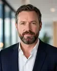 Professional man in a suit, conveying confidence and leadership, relevant to career coaching in Adelaide.