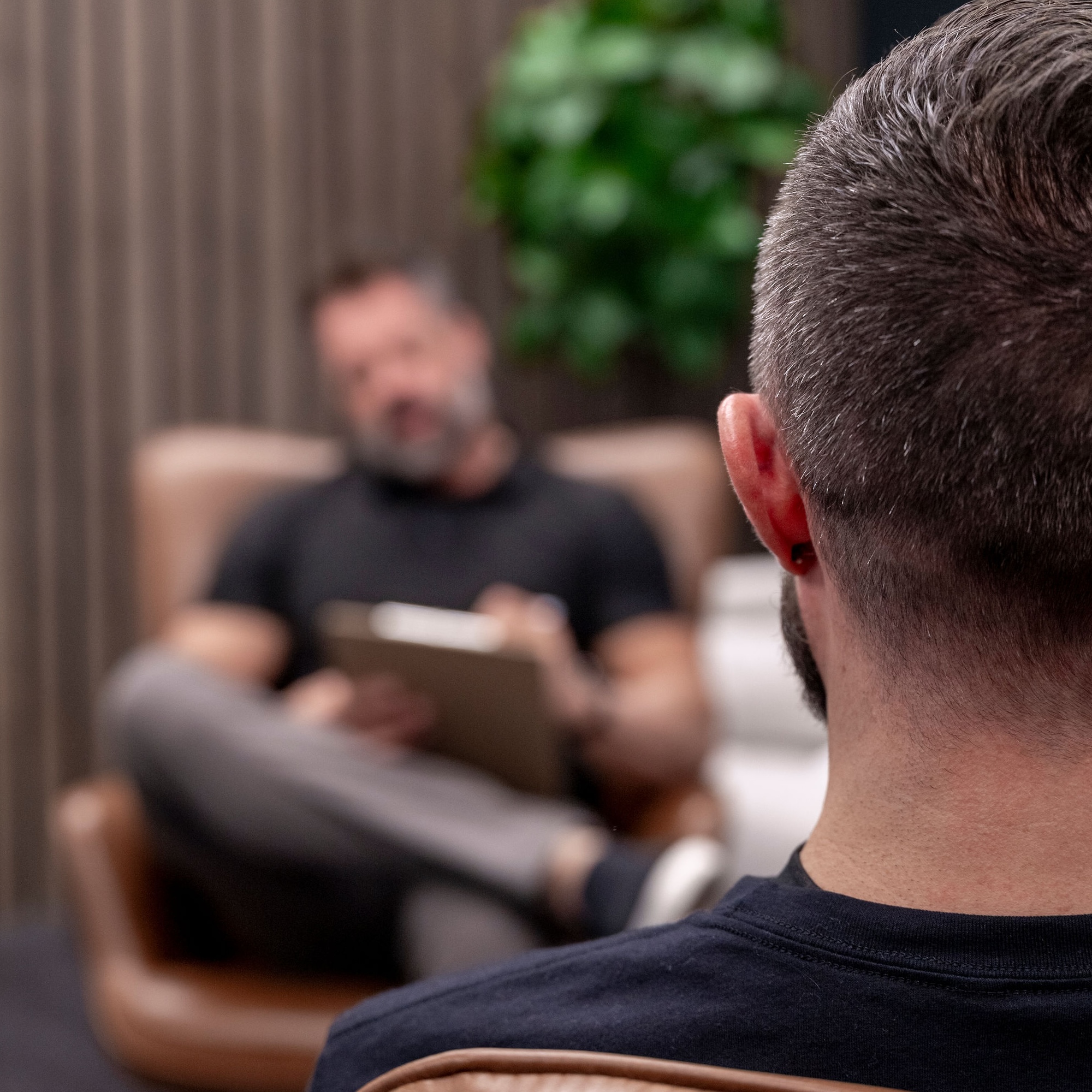 Tranquil spa suite with plush treatment bed and orchids