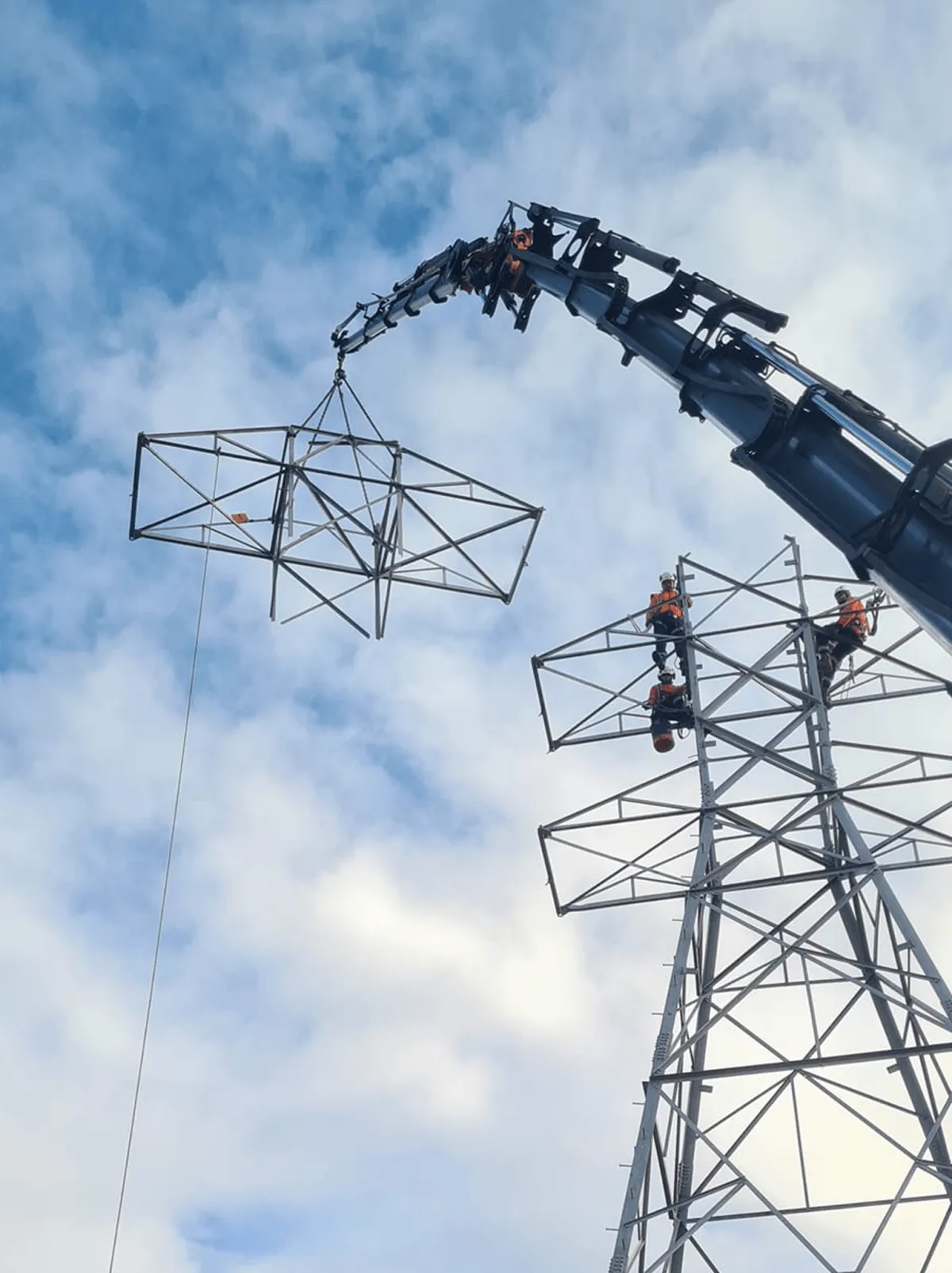 Large hiab crane lifting steel for powerline construction in Waikato