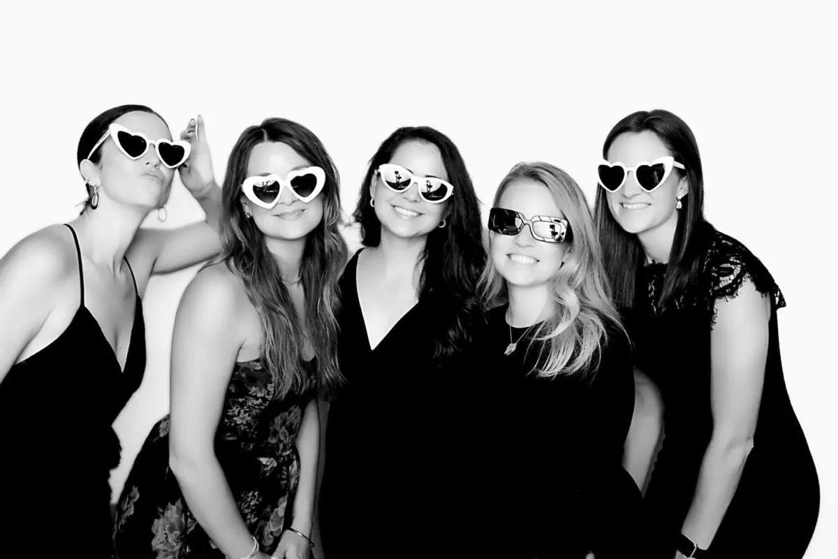 a group of women standing next to each other