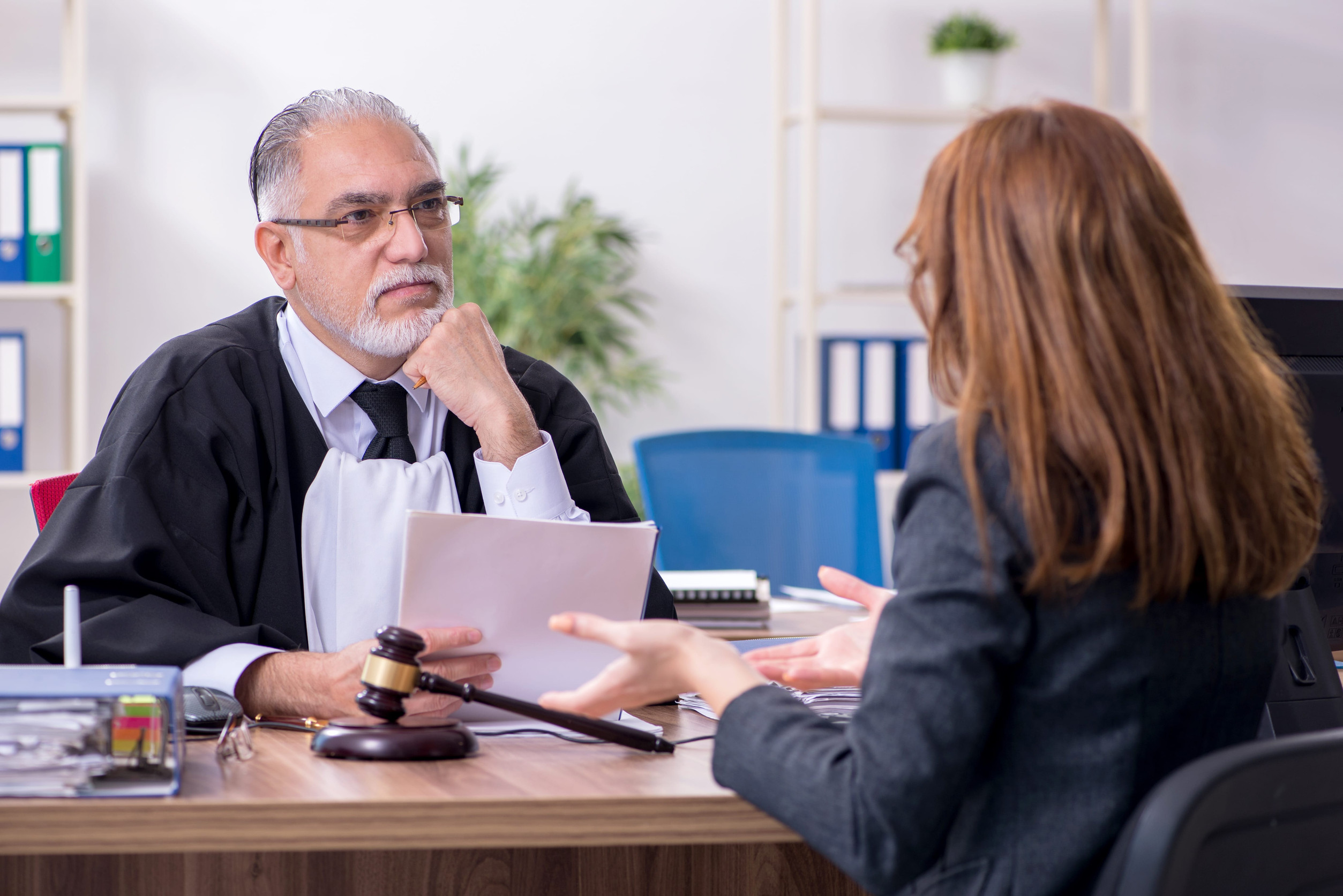 Doctor talking to patient in an office.