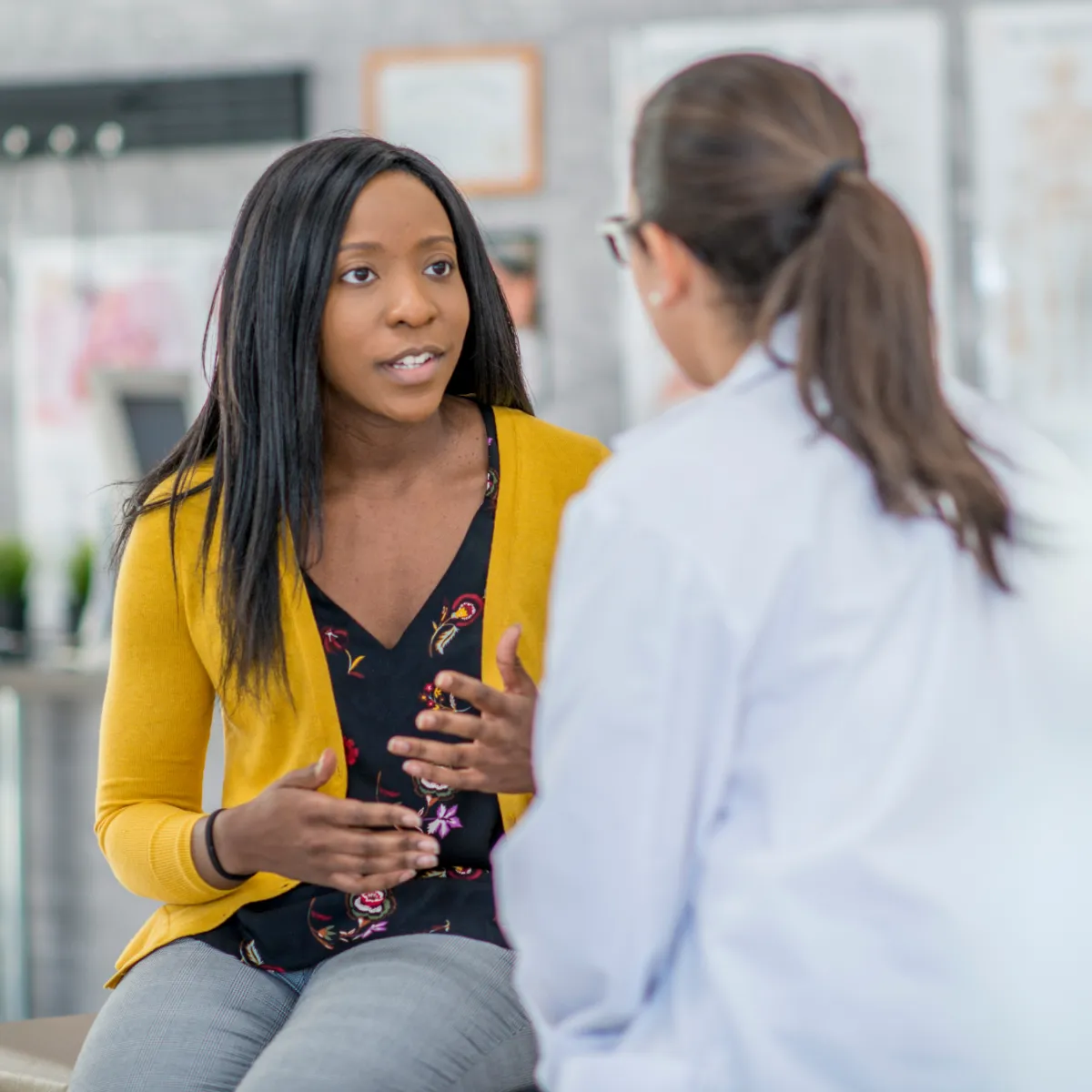 young female patient speaking with her doctor