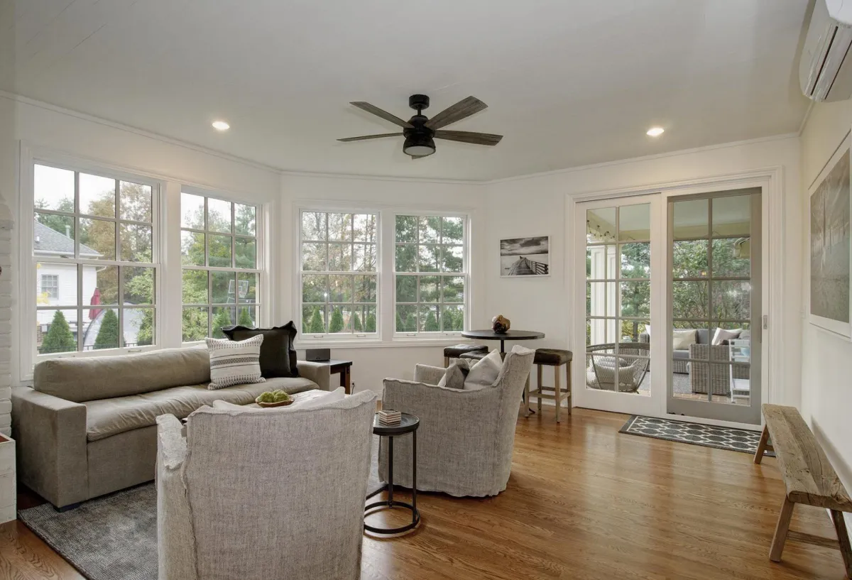 a beautiful white addition with ceiling fan