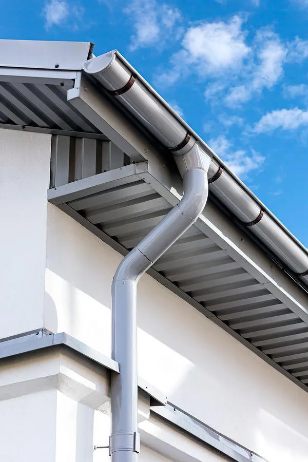 a very stylish gutter on a grey roof