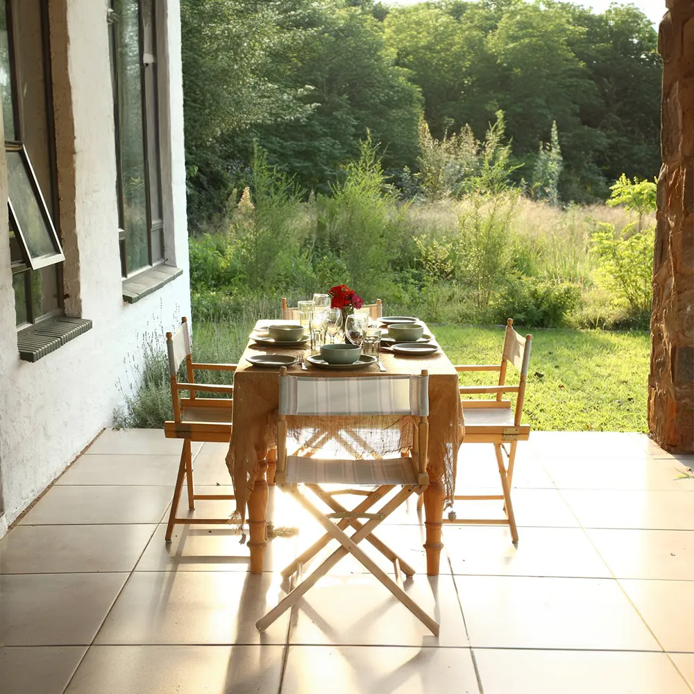 Farm-fresh breakfast basket provided to guests at Oude Doornbosch Cottages, including bread, fruits, and other local goodies.