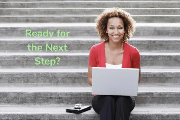 Image of woman sitting on steps with computer
