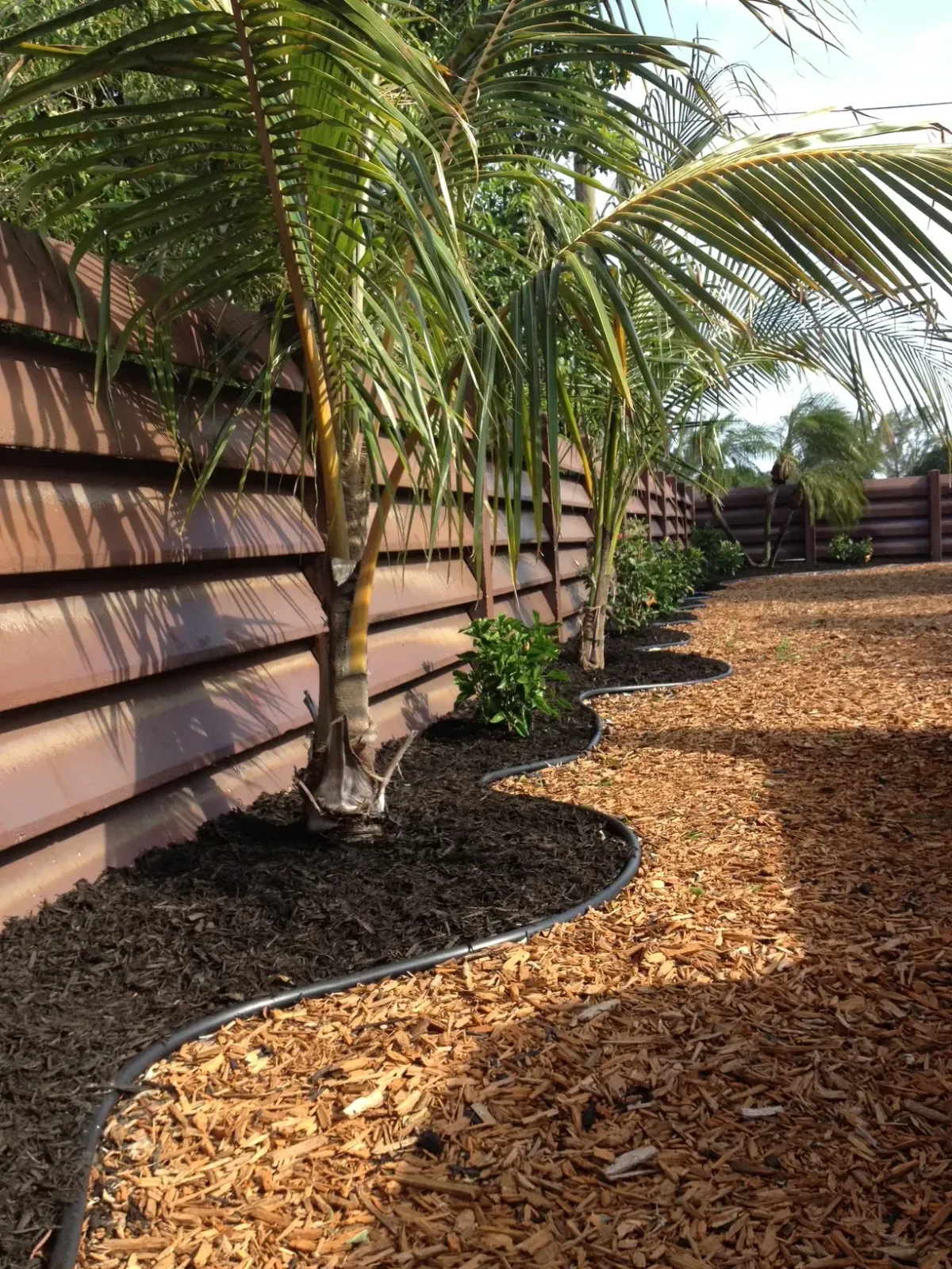 Mulch installation and tropical planting bed in Deerfield Beach – Quality Lawncare
