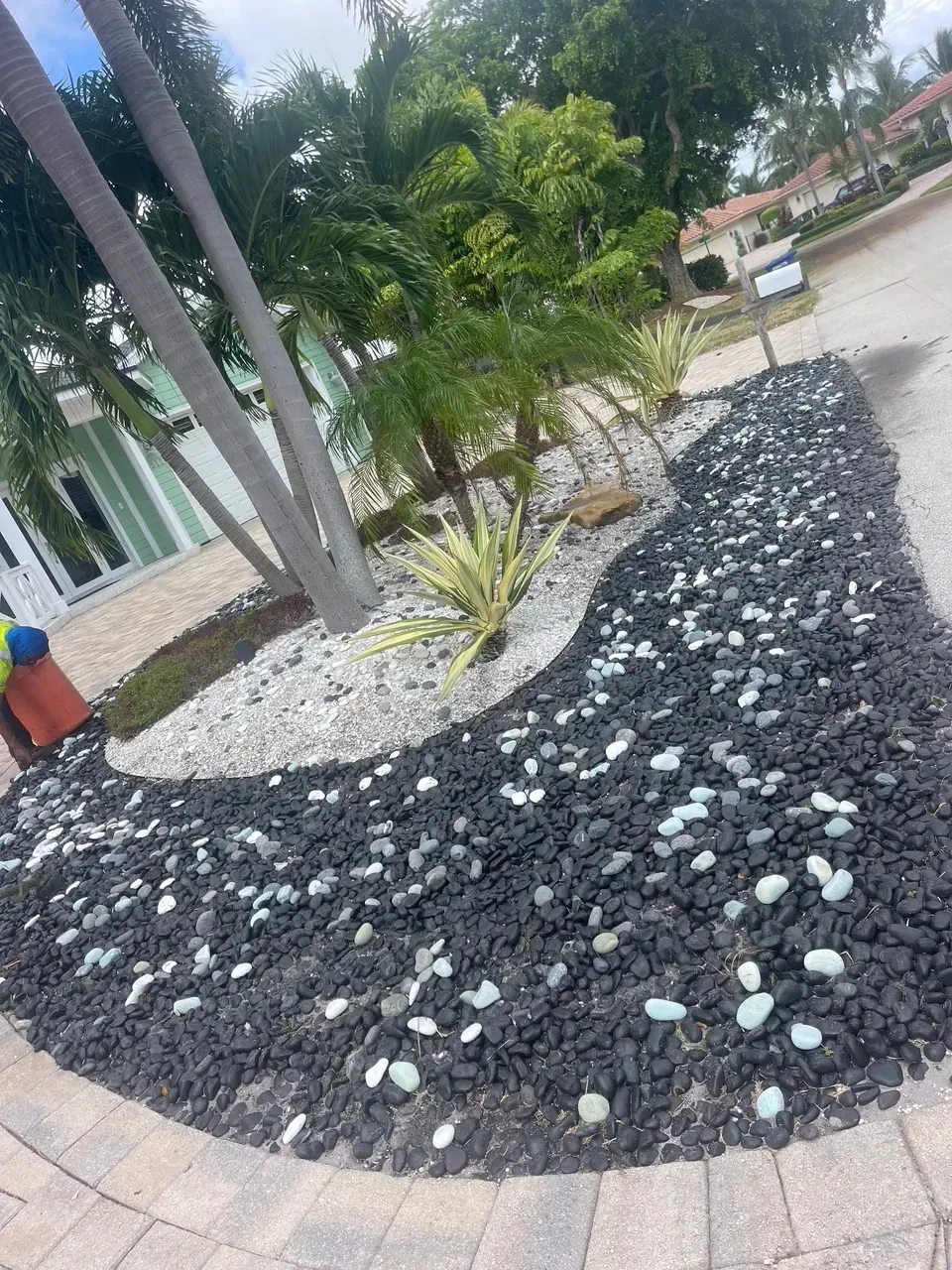 River rock and gravel landscaping in Deerfield Beach – Quality Lawncare & Landscaping