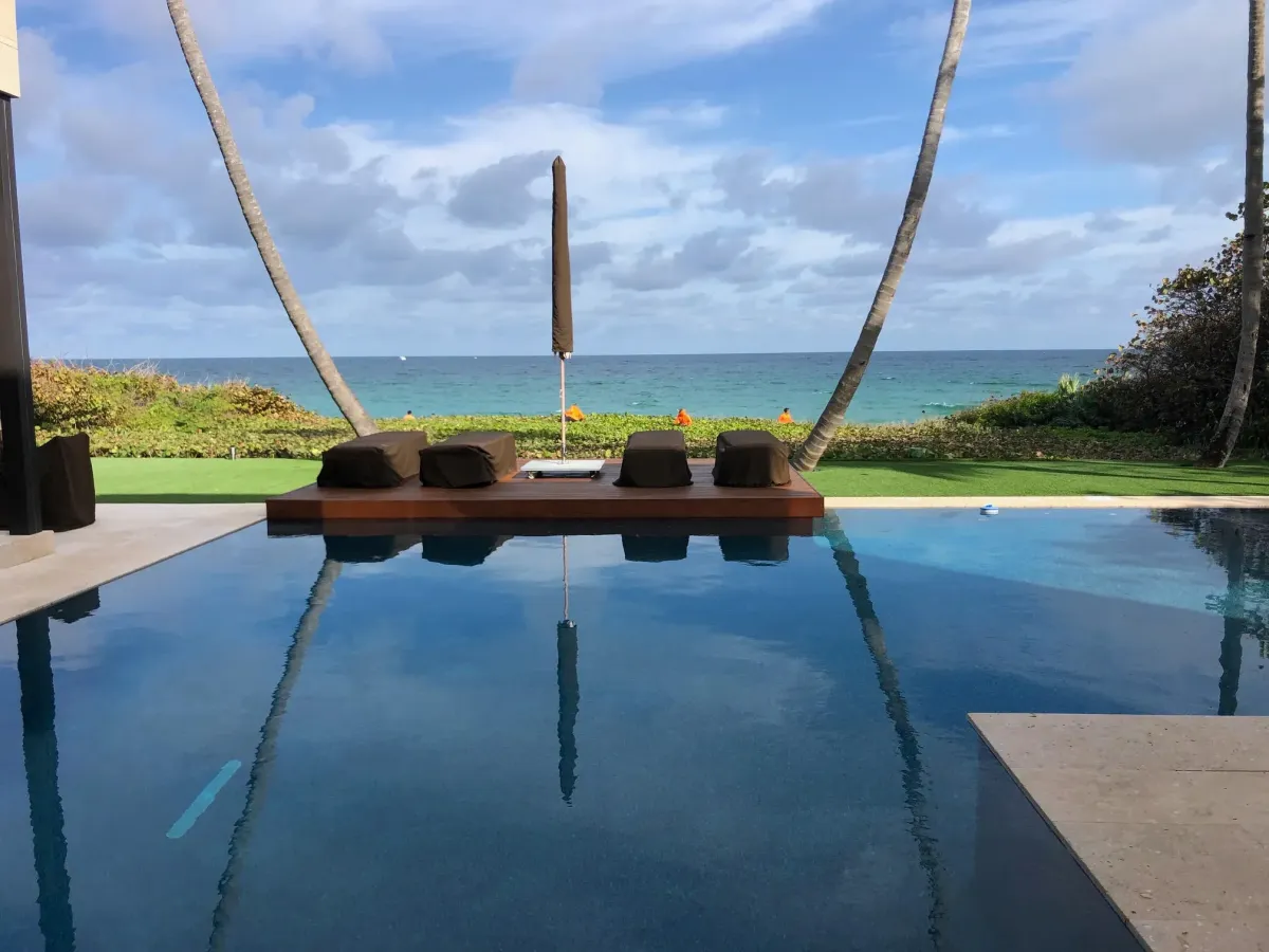 Poolside palm tree landscaping in Deerfield Beach – Quality Lawncare & Landscaping