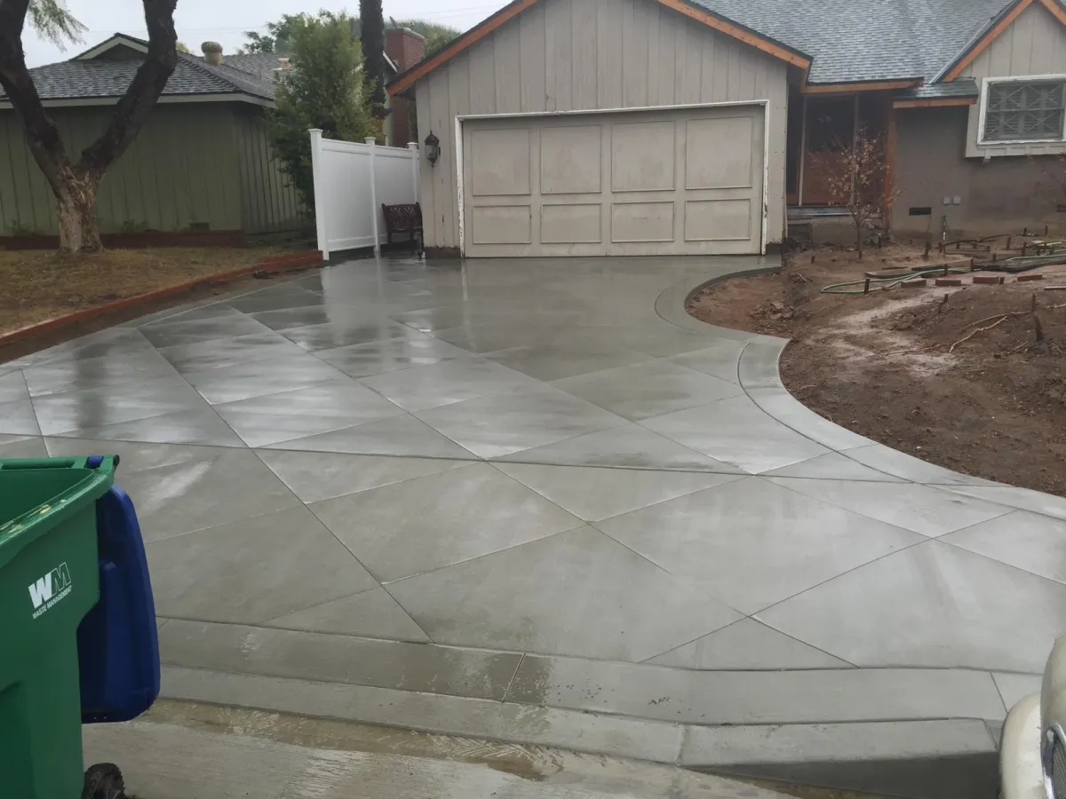Freshly poured concrete  driveway with diamond cuts for style.