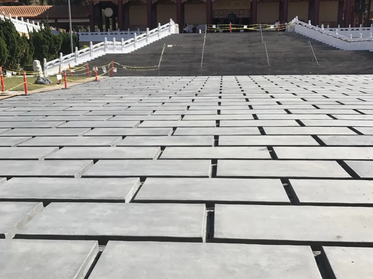 Concrete squares over a large area, creating a separated and grid-like floor.