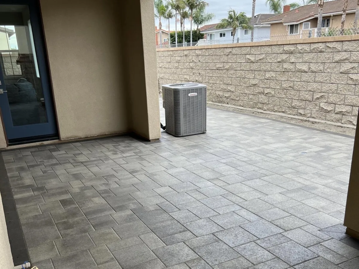 Interlocking Paver installation for the side walkway and back patio of a hous.
