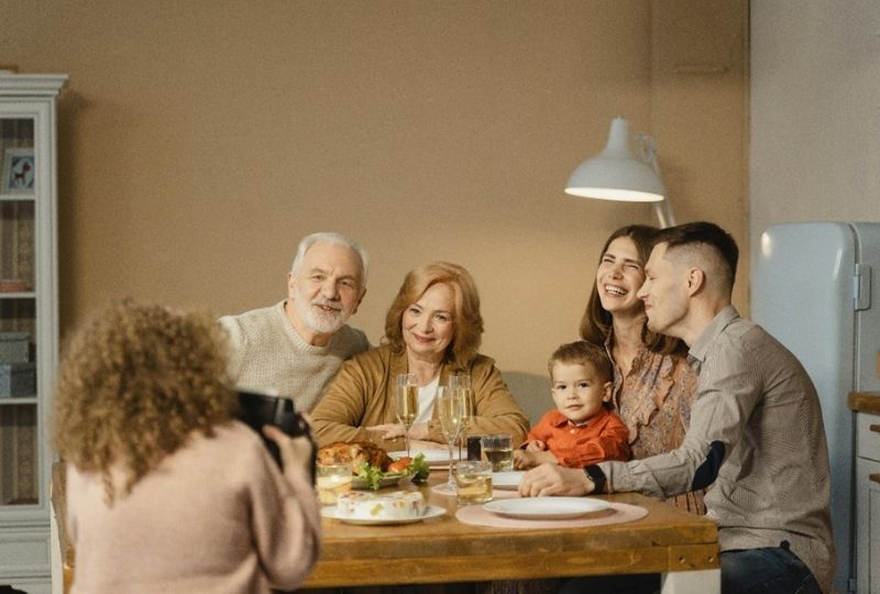 A happy family spending time together in their kitchen.