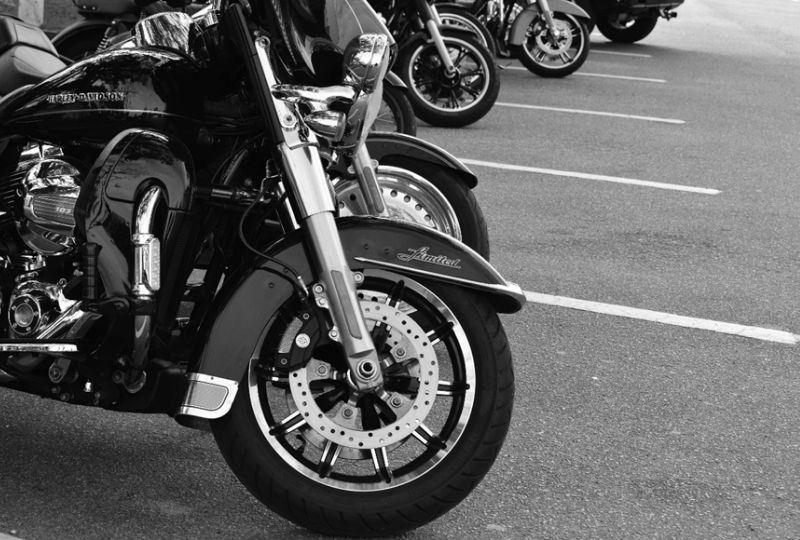 A row of motorcycles lined up closely together