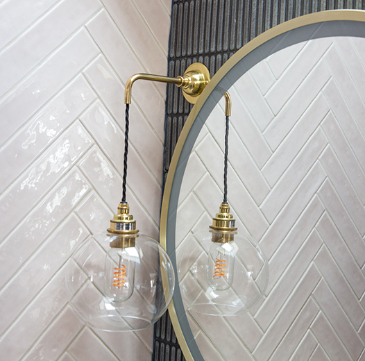 interior design photography of a pink bathroom with a hanging light