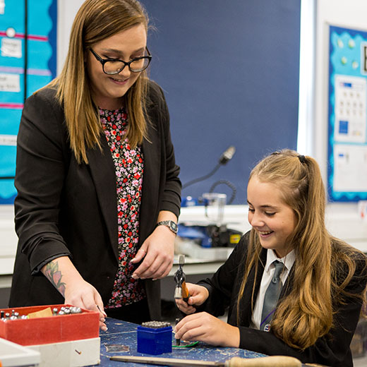 Commercial photography by Becky Kerr  Bedfordshire in a school with a teacher and student working 