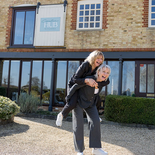 headshots of a women piggybackingbacking in front of their salon