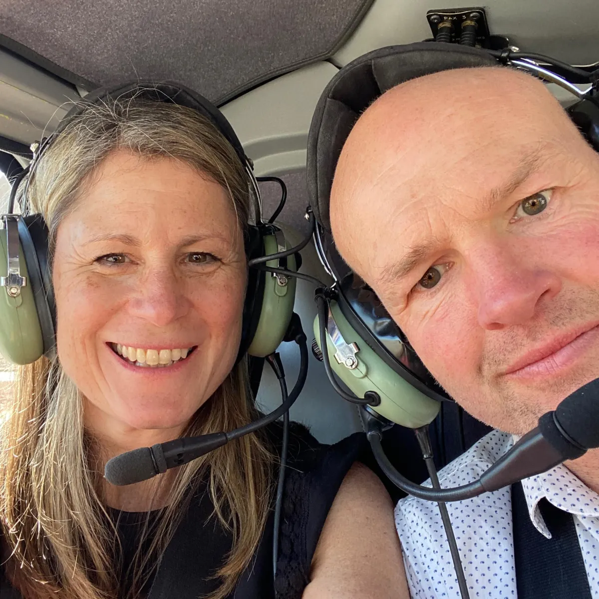 Becky Kerr photography with her husband in a helicopter in America 