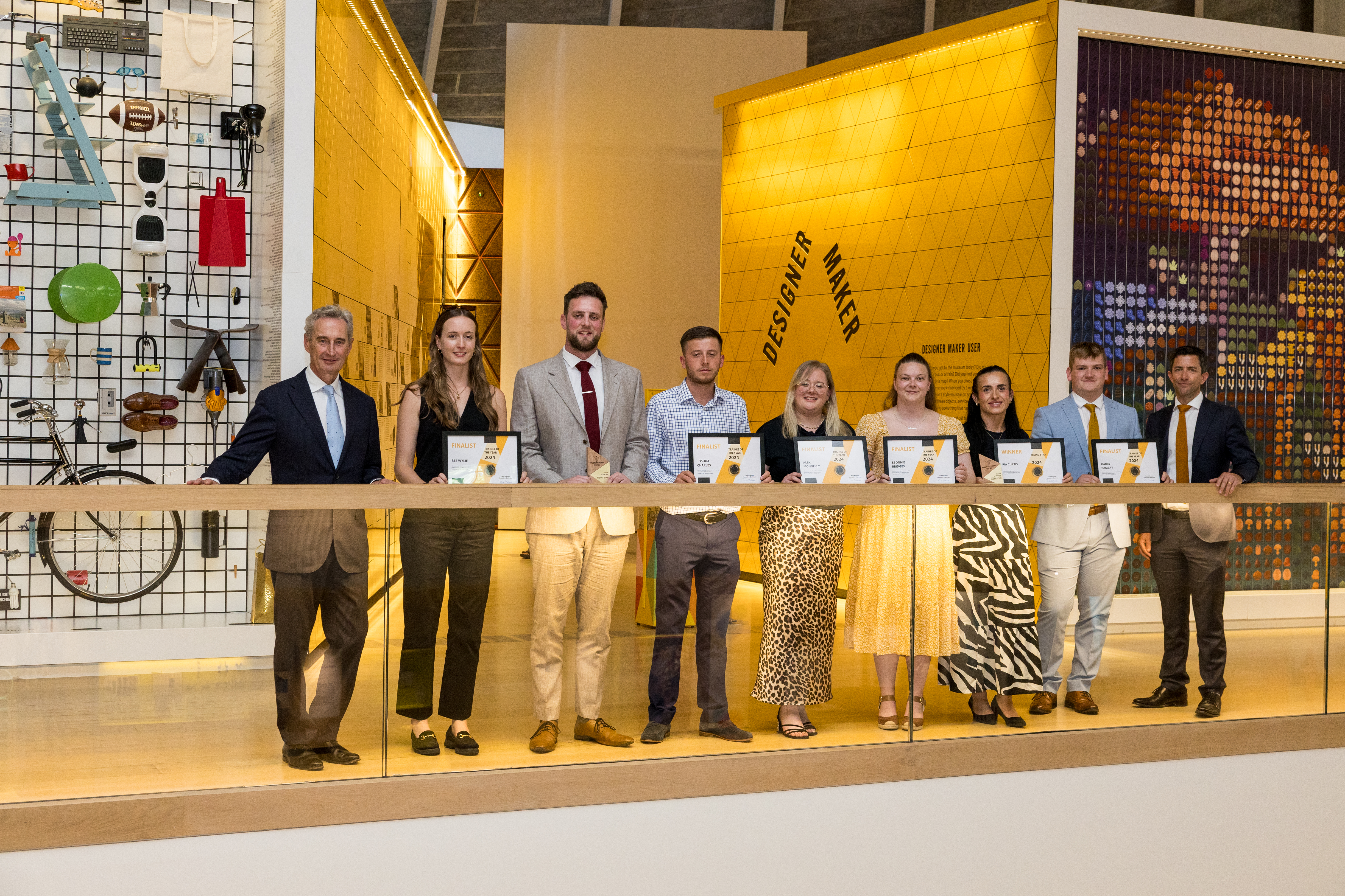 Team and group photo of a construction company in the design museum London 