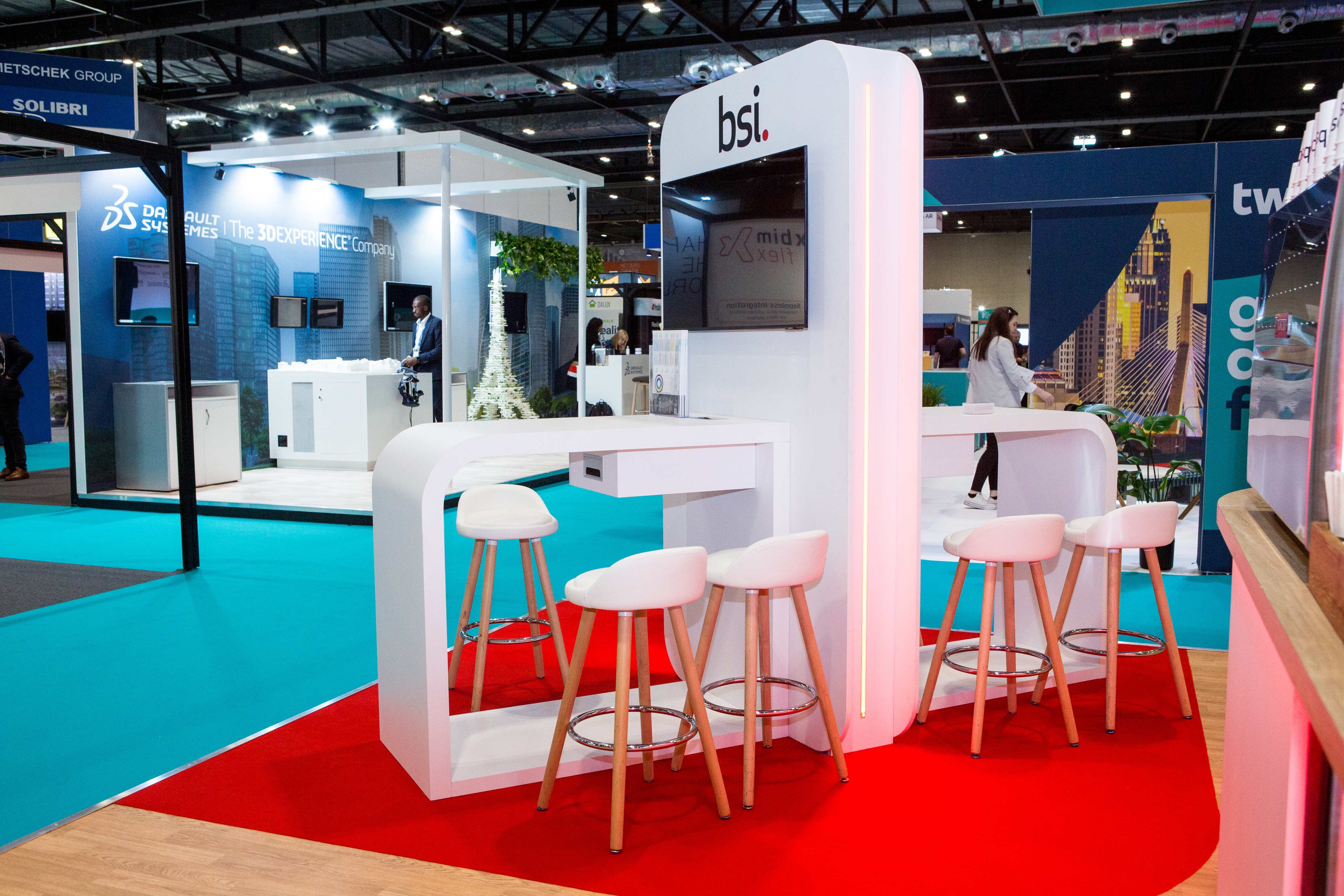 On-location photography of a white stand  with red carpet 