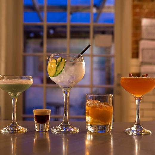 cocktails on a bar in a night setting of Bedfordshire bar.