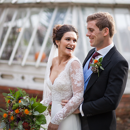 Bedfordshire autumn wedding with bride and groom laughing at each other 