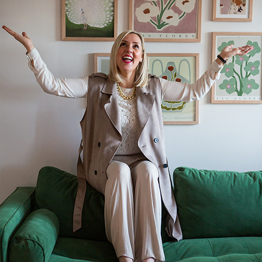 bedfordshire nutritionist preparing a bowl of food for her personal branding photography. she is wearing a bright pink blouse.