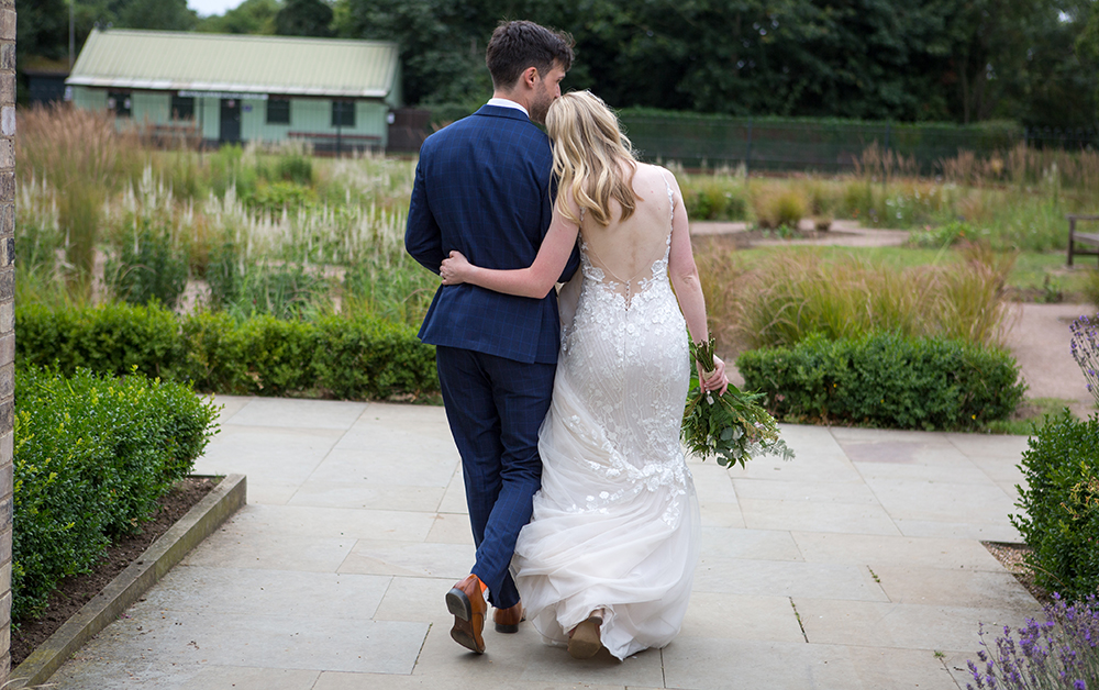 wedding photoraphy of a couple walking into the distance