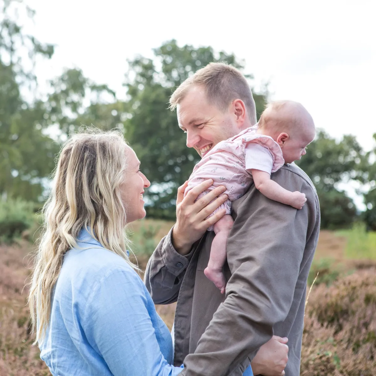 baby portrait photography with parents outside