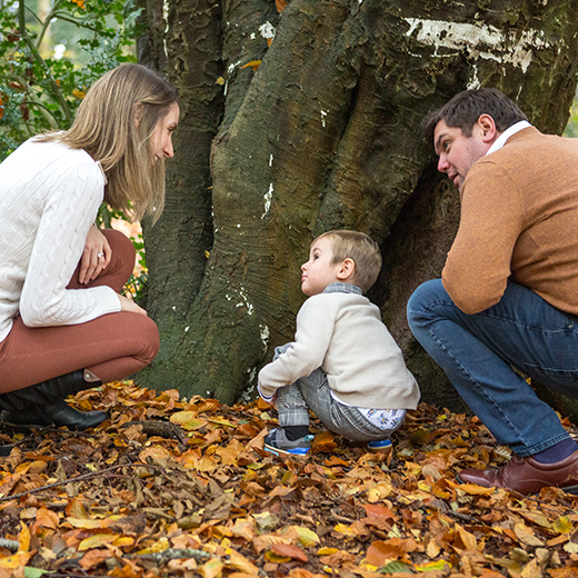 family portrait photo family looking at a tree