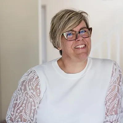 Personal branding photography Woman in a white top, smiling at the camera
